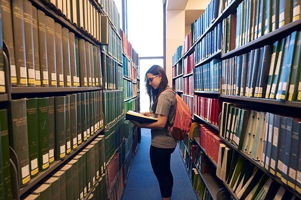 student in library